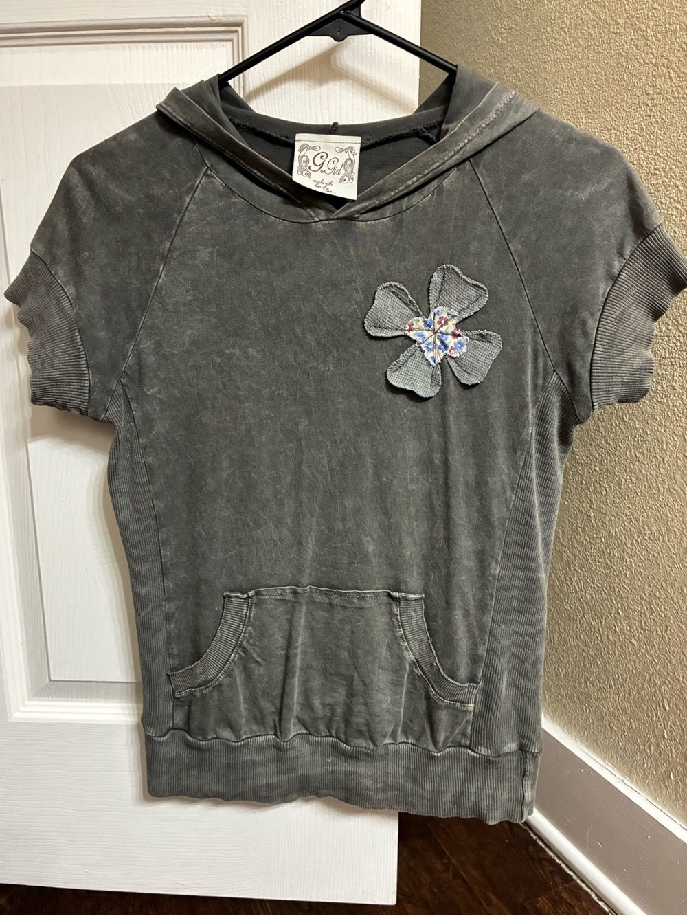 Women’s small grey hooded t-shirt.